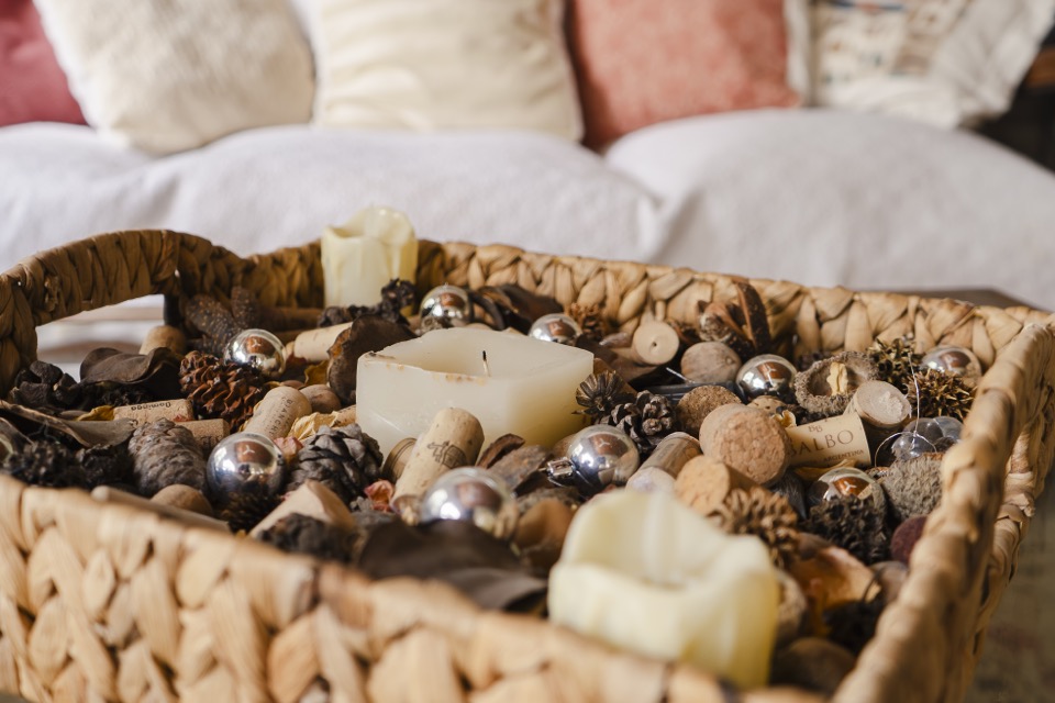 Decorative candles and corks on table